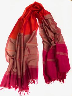 HANDMADE RAW SILK SCARF/ SHAWL  EACH PRODUCT IS UNIQUE AND ONE OF A KIND.  These scarves are made in Sri Lanka and are a product of hand looming, which is a traditional art carried through generations in Sri Lanka.  Yes, these beautiful products are made completely by hand and processed naturally. Red Pashmina Shawl For Festivals, Red Silk Pashmina Shawl, Traditional Red Scarves With Traditional Drape, Red Bollywood Pashmina Shawl In Traditional Drape, Red Bollywood Pashmina Shawl With Traditional Drape, Red Pashmina Dupatta For Festivals, Red Pashmina Dupatta Shawl, Red Cotton Silk Dupatta With Weaving Work, Red Pashmina Shawl With Traditional Patterns For Festivals