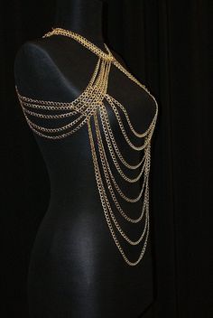 Here's a great and totally unique body chain necklace that makes the old 'little black dress' take on a whole different meaning! This gold body chain as I like to call it, adds the perfect amount of deco to your once all too simple party dress. It also looks great worn over a loose shirt, with jeans, conforming to the body in all the right places. Its great for a cocktail party or a night out at the clubs, this is definitely an attention grabbing piece. Would you like to see more body chain jewe Party Body Jewelry Choker With Chain, Summer Party Clavicle Chain Necklace, Long Backdrop Necklace With Clavicle Chain For Party, Summer Party Choker Jewelry, Adjustable Choker Body Chain, Bohemian Body Jewelry Choker For Party, Bohemian Body Jewelry With Chain For Summer, Party Metal Choker Body Jewelry, Bohemian Party Chain Necklace With Adjustable Chain