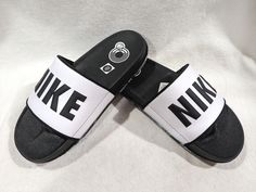 These Nike Offcourt slide sandals are lightweight sandals with a classic logo embellished on the strap. The innovative foam and jersey lining ensure an effortlessly comfortable experience. FEATURES Soft strap and binding on the upper ensure top-of-the-foot comfort Contoured footbed cradles the foot, and dual-density foam provides underfoot cushioning and stability Deep flex grooves help the slide bend with your foot CONSTRUCTION Manmade upper Jersey lining Foam midsole DETAILS Open toe Slip-on F Mens Slides Sandals, Mens Shoes Sandals, Mens Slides, Slides Sandals, Classic Logo, Slide Sandals, Open Toe, Binding, Clothing And Shoes