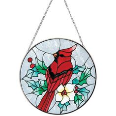 a stained glass window with a cardinal on it's side hanging from a chain