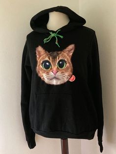 Quirky Kunstboer cat patch sewn on black hoodie size L Casual Winter Sweater With Cat Print, Casual Cat Print Sweater For Winter, Casual Cat Design Hoodie Sweatshirt, Black Hoodie With Cat Design, Casual Hoodie Sweatshirt With Cat Design, Fall Cat Design Hoodie Sweatshirt, Casual Cat Design Hoodie For Fall, Casual Hoodie With Cat Design, Casual Hooded Hoodie With Cat Print