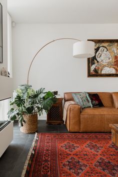 a living room filled with furniture and a rug