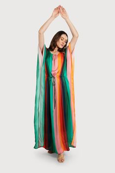 Turn heads this summer in our stunning Multicolor Striped Tie Waist Kaftan. This kaftan is made from lightweight, drapey fabric and ensures both comfort and style. Flowy stripes and a delicate keyhole neckline create a touch of effortless elegance. The tie waist cinches for a flattering fit, making it perfect for everything from breezy beach days to chic soirées. Material: 100% Viscose Satin Made In India Keyhole Neckline, Effortless Elegance, Striped Tie, Vertical Stripes, Spring Green, Beach Days, Cinched Waist, This Summer, Stripes