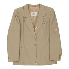 Description:Vintage beige Burberry blazer, fits large.GENDER: womens CONDITION: good - dark mark on front lapels and faint light coloured streak on left sleeve, as well as a dark mark on back. all marks less than 1 cm in size.STYLE: blazerERA: 1990sCOLOUR: beigeFABRIC: cottonNotes: Garment does not have size label however fits a women's large. Pit to pit measurement is 20". Composition is listed as 100% cotton. Vintage Beige Sport Coat For Work, Vintage Workwear Sport Coat With Suit Collar, Vintage Beige Single-breasted Blazer, Vintage Cream Blazer For Work, Classic Beige Sport Coat For Office, Vintage Cream Blazer For Workwear, Vintage Blazer With Suit Collar For Work, Vintage Sport Coat With Suit Collar For Work, Vintage Beige Sport Coat For Spring