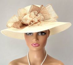 This hat is a very elegant and sophisticated ivory colored straw hat. A beautiful design featuring Sinamay flowers and leaves in light tan,ivory, beige and white  This creation is a perfect hat for church or for the Kentucky Derby. Stunning for a wedding party or tea party. Amazing hat for special occasions. You will love it! Brim: 4" Rise: 4" Size: Internal Draw String to adjust to any size head Hat Tea Party, Easter Hat, Sinamay Hats, Easter Hats, Hat Wedding, Church Hat, Tea Party Hats, Kentucky Derby Hat, Derby Hat