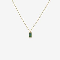 Details Lola Brooks 18k & mirror-cut blue green tourmaline necklace, 3.10cts. The stone measures approximately 1/2″ x 1 1/4″ & is set in Lola's signature fine closed bezel setting. The pendant hangs from an 18", 18k yellow gold chain. - blue green tourmaline - 18k yellow gold - 18" total length Modern Green Necklace For Formal Occasions, Formal Green Necklace With Rectangular Pendant, Green Rectangular Pendant Necklace For Formal Occasions, Yellow Gold Necklace With Emerald Rectangular Pendant, Modern Green Rectangular Pendant Jewelry, Formal Green Tourmaline Necklace, Green Tourmaline Necklace In Fine Jewelry Style, Blue Emerald Necklace As A Gift, Minimalist Emerald Necklace For Formal Occasions