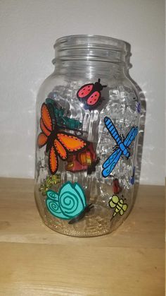 a glass jar filled with lots of colorful magnets