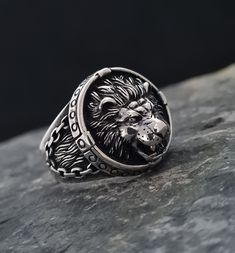 Signet Men's Ring 925 Sterling Silver,The Lion's Playful Tongue Ring,Handmade 925 Sterling Silver,Lively Lion Ring,Gift for Him Embrace the untamed spirit with this captivating lion with its tongue playfully sticking out ring. The intricately detailed design showcases the majestic lion in all its glory, featuring its powerful mane and intense gaze. With the playful addition of the extended tongue, this ring adds a touch of whimsy to your style. Wear this unique piece as a symbol of strength and Lion Rings, Tongue Ring, Rings Men, Majestic Lion, Oxidized Ring, Lion Ring, Ring Man, Head Ring, Tongue Rings