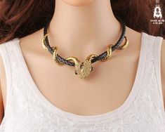 Gothic Double Snake Choker Necklace Gold Plated Unisex Leather Choker Snake Jewelry Chain Serpent Necklace Wiccan Jewelry Rock Hip Hop Style Make a bold statement with this Gothic Double Snake Choker Necklace, a stunning fusion of edgy rock, hip hop, and Wiccan-inspired style.  Featuring two intricately detailed snakes, this gold plated choker symbolizes strength and resilience, perfect for anyone looking to add a daring touch to their wardrobe. Crafted from high-quality leather and durable zinc Snake Choker Necklace, Serpent Necklace, Snake Choker, Wiccan Jewelry, Style Rock, Hip Hop Style, Snake Jewelry, Jewelry Chain, Gold Choker Necklace