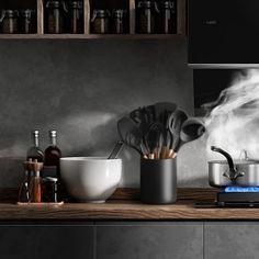 a kitchen counter with pots and pans on it