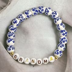 Grandma Bracelet Handmade Glass Porcelain Beads White And Blue Mothers Day Everyday White Stretch Bracelet With Large Beads, Blue Letter Beads For Gifts, White 8mm Beads For Gifts, Grandma Bracelet, Porcelain Beads, Glass Beaded Bracelets, Bracelet Handmade, White Glass, Handmade Bracelets