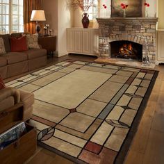 a living room filled with furniture and a fire place next to a couch in front of a fireplace