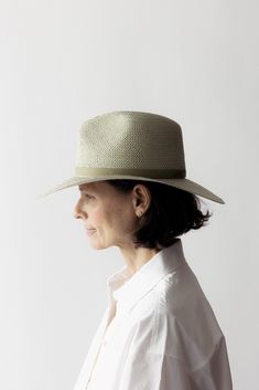 Details Simone is a classic style fedora made with packable straw and a structured modern shape. Rich black or sand straw with a tonal leather band creates a minimal and timeless look. This hat was made to accompany you to the beach, under the sun, to dinner, and anywhere you travel in between. · Brim: 3.5"· Crown: 4"· 1" Leather Band· Signature Gold Screw· Made in the USA· UPF 45+ Fit Runs true to size. If between sizes, we suggest sizing up. Janessa Leone Hat, Valentine Hats, Women Fedora, Freda Salvador, Janessa Leone, Straw Fedora, Exclusive Clothing, Beautiful Hats, Swimwear Cover