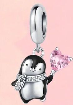 Silver and black penguin with a white crystal adorned scarf holding a pink heart crystal balloon hanging from a simple silver hoop. Pink Heart Crystal, Wearing A Scarf, Pink Zircon, Painted Eyes, Penguin Love, Bracelet Pandora, Heart Crystal, Pandora Bracelet Charms, Necklace Charm