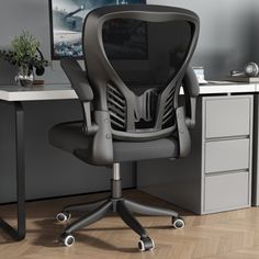 an office chair sitting in front of a computer desk