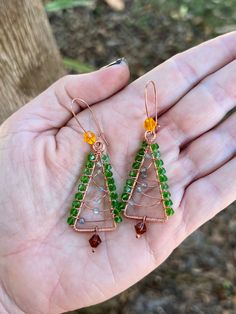 Each set is made to order. Hand made and hand coiled high quality copper Christmas Tree earrings made with Czech Crystals and little Labradorite ornament beads. These come on copper Kidney Wire ear hooks Earrings measure approximately 2.75" long (Top of ear hook to bottom bead) Please note that due to their handmade nature, these earrings may vary slightly from the stock photo pictured. Wire Wrapped Beaded Earrings In Copper Wire For Gifts, Green Copper Wire Earrings Gift, Copper Beaded Earrings With Ear Wire As Gift, Copper Christmas Tree, Crystal Labradorite, Copper Christmas, Crystal Christmas Tree, Tree Earrings, Christmas Tree Earrings