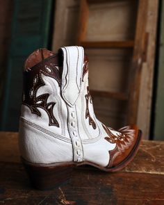 Whether you're looking for a statement piece to make heads turn or a versatile option for everyday wear, Circle G by Corral​ boots offer an unparalleled range of options to cater to your taste. 7.5" Height Leather ​Pearl White Cognac Overlays Snip Toe Leather Lining ​Leather Outsole Single Stitch Welt Western Heel Pull On Pull Straps​ Embroidery Boots, Corral Boots, Pearl Leather, Pearl White, Cognac, Cowboy Boots, Statement Pieces, Camel, Cowboy