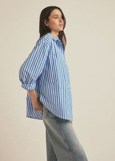 We took our best-selling Ex-Boyfriend Shirt and opened it up (just a bit). The Door's Always Open Ex-Boyfriend Shirt is an oversized button up with a relaxed fit, pointed collar and open hem. It is cut in a soft cotton poplin in Azure Stripe.100% Cotton Yarn Dye Gaby is 5'9" wearing size S. Blue Tops With Striped Collar And Relaxed Fit, Blue Shirt With Striped Collar For Daywear, Blue Vertical Striped Collared Top, Boyfriend Shirt, Ex Boyfriend, Yarn Dyeing, Cotton Poplin, Cotton Yarn, Button Up