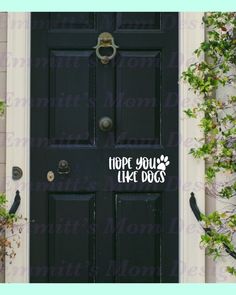 a black door with the words hope you have dogs on it and some ivys