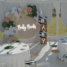 a baby shower party with giraffe balloons and zebra - print tablecloths