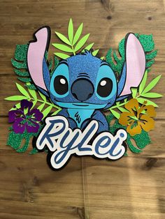 an image of a sticker with the name riley on it and lillies around it