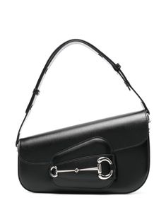 black leather asymmetric design adjustable shoulder strap signature Horsebit detail main compartment internal zip-fastening pocket internal logo patch canvas lining silver-tone hardware front flap closure with strap fastening Planet People, Chanel 2, Demi Fine Jewelry, Shoulder Bag Black, Black Shoulder Bag, Asymmetrical Design, Fine Earrings, Ballet Flat Shoes, Black White Red