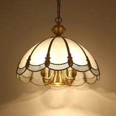 a light fixture hanging from the ceiling in a room