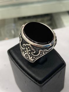 It is a carefully crafted product made of 925 sterling silver. Luxury Hallmarked Onyx Rings, Classic Sterling Silver Jewelry With Black Enamel, Luxury Black Engraved Ring For Formal Occasions, Black Engraved Ring With Polished Finish For Formal Occasions, Formal Black Engraved Ring With Polished Finish, Formal Black Engraved Ring, Fine Silver Onyx Jewelry, Luxury Black Oval Rings, Luxury Black Engraved Ring With Polished Finish