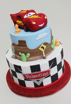 a birthday cake with cars on top