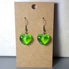 These gummy heart earrings are perfect to bring you back to your childhood! They come in any color of the rainbow, so you can be sure to get the color you like! They are made with sterling silver hooks to ensure that your ears are not affected! Green Heart Charm Earrings For Valentine's Day, Trendy Heart Drop Earrings As Gift, Green Heart Beads Earrings For Gift, Green Dangle Heart Charm Earrings, Green Nickel-free Heart Earrings As Gift, Nickel Free Green Heart Earrings, Green Heart Drop Earrings For Gifts, Green Earrings With Heart Beads For Gifts, Nickel-free Green Heart Earrings