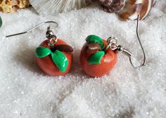 Welcome to Buried Jewelry Teachers, get ready for the new school year with these cute apple earrings.  Add these cute handmade polymer clay red apple earrings to your fall wardrobe. These apples are handmade with polymer clay. The ear wires are stainless steel and the pumpkins are 13mm wide.    Hello and welcome to BuriedJewelry. We thank you for stopping by. All the products in our shop are handmade and one of a kind. They are made in a smoke-free work studio by our family. We list new items weekly so there is always something fresh. We are happy to do custom work so if you have something in mind let us know and we will be able to create it for you or as a gift.                               **Our earrings are a handmade item. They are created with love Shipping method: Your purchases wil Orange Clay Jewelry For Gifts, Handmade Orange Clay Jewelry, Polymer Clay Apple, Clay Apple, Apple Jewelry, Teacher Earrings, Apple Earrings, Work Studio, Earrings Clay