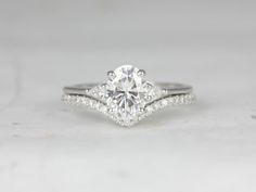 a white gold engagement ring with diamonds on it