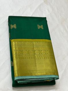 Bridal Collection Green Color Pure Kanchipuram Silk Saree | Indian Traditional Ethnic Saree | Wedding or Party Wear Saree | Handwoven Gift Saree for Her Product Details : Saree Type : Pure Kanchipuram Silk Saree Golden Zari, Silk Mark Certified Blouse Piece : Yes (Un-Stitched) Saree Length : 5.5 Meters Blouse Piece Length : 80 cm Saree Weight : 0.9 kg Saree Fabric : Pure Kanchipuram Silk  Color : As shown in the picture Work : weaving Pattern : designer Occasion: Party Wear, Formal Wear, Festiva Green Handloom Traditional Wear For Wedding, Green Lehenga With Motifs For Puja, Ceremonial Gold Blouse Piece With Motifs, Ceremonial Green Dupatta For Navratri, Gold Pre-draped Saree For Eid Ceremonies, Gold Pre-draped Saree For Eid And Traditional Ceremonies, Green Handloom Lehenga For Wedding, Ceremonial Green Tussar Silk Dupatta, Ceremonial Blouse Piece In Gold With Self Design