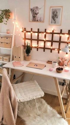 a white desk topped with a laptop computer