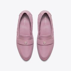 Our Ballet Loafer® is an interpretation of two classics — the flexibility of a ballet slipper with the profile of a loafer. The insole provides performance-level comfort, ruched sides secure the foot and treads on the outsole add traction. It is crafted in leather and detailed with a Double T in brushed gold. The shoe's edges are hand-painted and the strap is hand-stitched. Classic Slip-on Ballet Flats With Textured Sole, Business Moccasins With Textured Sole For Spring, Spring Business Slip-on Ballet Flats, Elegant Slip-on Moccasins With Textured Sole, Elegant Almond Toe Moccasins With Cushioned Footbed, Luxury Slip-on Ballet Flats With Rubber Sole, Spring Formal Moccasins With Textured Sole, Classic Formal Slip-on Ballet Flats, Classic Slip-on Ballet Flats With Rubber Sole