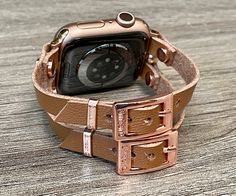 High Quality Italian Tan Color Vegan Leather Strap Bracelet. Double Strapped 7mm Strap with Adjustable Buckles. Gorgeous Design Bracelet Tailored to Perfection. Designed And Handmade by Simeon D Jewelry Studio. This Bracelet Fits ALL Apple Watch Series. Please Measure Your Wrist Before Submitting Your Order! Not For Other Models. Apple Watch Is NOT Included. Ultra Fiber Vegan Leather: -Moisture-Wicking and Heat-Dispensing -Water-Washable -Breathable -Lightweight Let's be Friends! Follow my Studi Adjustable Apple Watch Band For Everyday Use, Modern Rectangular Rose Gold Watch Bands, Trendy Adjustable Watch Bands For Everyday, Rose Gold Apple Watch Band As Gift, Rose Gold Apple Watch Band Gift, Rectangular Rose Gold Apple Watch Band Gift, Adjustable Bracelet Strap Apple Watch Band, Adjustable Rectangular Bracelet Strap Apple Watch Band, Adjustable Rectangular Apple Watch Band With Bracelet Strap