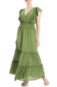 Lightweight fabric is shaped into this flowy crepe maxi dress designed with tiers of ruffles and smocked detailing. Surplice V-neck Short flutter sleeves 97% polyester, 3% spandex Machine wash cold, line dry Imported Model stats: 5'10", 32" bust, 25" waist, 36" hip. Model is wearing size Small. Spring Billowy Ruched Maxi Dress, Billowy Ruched Maxi Dress For Spring, Beach Chiffon Maxi Dress With Ruffle Hem, Chiffon Maxi Dress With Ruffle Hem For Beach, Bohemian Chiffon Maxi Dress With Ruffles, Green Ruched Flowy Maxi Dress, Casual Chiffon Maxi Dress With Smocked Back, Chiffon Maxi Dress With Ruffles For Vacation, Green Tiered Ruffle Dress For Beach