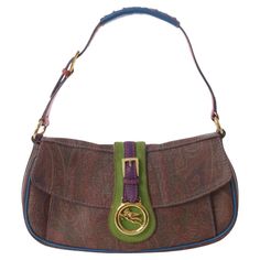 Etro Multicolor Patterned Shoulder Bag is a hobo bag that can also be held by hand thanks to the adjustable handle with golden logo buckle. front closure with magnetic flap and single interior compartment with zippered pocket. logo charm on the front flap. features Etro's signature paisley-style pattern and contrasting leather and multicolor suade inserts. CONDITION Very good condition (Please consult the guide below) LABEL Etro - Made in Italy COMPOSITION 100% leather MEASURES Length 30 cm / 11,8 inches Height 18 cm / 7 inches Depth 5,5 cm / 2,1 inches Handle height 20 cm / 7,8 inches Please take note that this is a vintage garment and in most cases has not been cleaned professionally in decades. All items are sold as is and all sales are final. Please feel free to ask any questions! COND Flap Shoulder Bag With Gold-tone Hardware In Coated Canvas, Multicolor Double Handle Shoulder Bag With Gold-tone Hardware, Everyday Shoulder Bag With Magnetic Closure In Coated Canvas, Daily Use Coated Canvas Shoulder Bag With Magnetic Closure, Rectangular Coated Canvas Bag With Magnetic Closure, Multicolor Shoulder Bag With Gold-tone Hardware For Travel, Daily Use Coated Canvas Bag With Magnetic Closure, Multicolor Rectangular Shoulder Bag With Gold-tone Hardware, Multicolor Coated Canvas Satchel Shoulder Bag