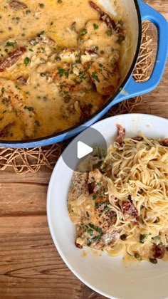 two plates of food on a wooden table with a blue casserole dish next to it