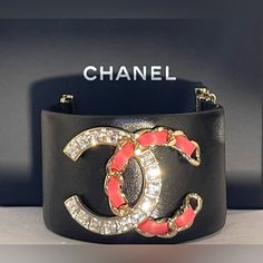 Stunning Chanel Bracelet With Rhinestone Cc Logo. 100% Authentic!!! Very Hard To Find!!! Chanel Is Currently Not Producing This Style Leather Bracelet. Bracelet Is In Very Good Condition. Don’t Miss Out In This Rare Piece!!! Length 6” (Leather Only)..6 1/2” Total. Basically Fits Wrist. 6” Or Smaller, 1 3/4” Wide. Comes With Original Box And Card. Please See All Photos....Talk About Making A Statement!!! Dimensions: Luxury Black Bling Jewelry, Luxury Rhinestone Bracelets For Party, Designer Jewelry With Rhinestones For Gift, Luxury Rhinestone Party Bracelets, Luxury Evening Bracelets With Bling, Luxury Bling Bracelets For Party, Luxury Party Bracelets With Bling, Luxury Pink Jeweled Jewelry, Luxury Diamond Jeweled Bracelets