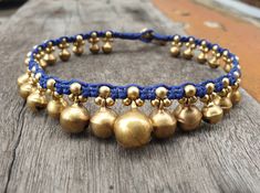 This anklet or bracelet made with brass bells and brass beads woven together with navy blue waxed cord and brass bell for closure. It's jingling sound when you move!! *Size: Choose your size or colors of cord from the drop-down menu. If you need silver instead of brass, just take note to me in the message to seller. *✈️ Shipping.. The item shipped by registered airmail Thailand Post within 3-5 working days after payment received. - United States and Europe: It's will take about 2-4 weeks to deli Adjustable Festival Jewelry With Bells, Adjustable Bells Jewelry For Festivals, Adjustable Gold Anklets With Latkans, Bell Anklet, Wax Cord Bracelet, Waist Jewelry, Beautiful Anklet, Brass Bell, Cord Jewelry