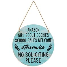 a sign that says amazon girl scout cookies school sales welcome intense no solicing please