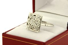 This fantastic ring is made in brilliant 14K white gold with dazzling pave set diamonds. This Mosaic square styled cocktail ring is set with 0.75ct total weight in white diamonds. The head of the ring is 16.22mm wide 16mm long and sits 6mm tall. The ring is a size 7.75 and can be resized upon request. B955FYSPD --Please reference our policy for more details-- For International orders, please provide a phone number for shipping purposes. Just place a note in the comment box during check out.Thank Square Cut Platinum Diamond Ring With Accents, Diamond White Platinum Square Cut Diamond Ring, Platinum Square Cut Diamond Ring In Diamond White, Dazzling Rectangular Diamond Ring For Anniversary, Silver Platinum Diamond Ring With Square Cut, Square White Gold Ring For Anniversary, White Gold Diamond Ring With Square Cut Accents, Dazzling Square Cut White Gold Diamond Ring, Anniversary White Gold Square Ring