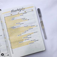 an open planner and pen sitting on top of a white sheet with the words study written in it