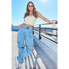 A pair of high-waisted wide-fit jeans featuring bottom strings to tie up, pin-tucked front line, straight cutouts on the knee area, a 5-Pocket construction, and zip-fly closure. This 99% cotton rigid denim can present perfect wide jeans fit. -Rise: 12.5", Inseam: 29.5" -Model is 5'9" and wearing a size M -True to size Trendy Ripped Cargo Jeans For Spring, High Waist Ripped Cargo Jeans For Spring, Ripped Straight Leg Cargo Jeans For Spring, Spring Ripped Straight Leg Cargo Jeans, Spring Straight Leg Ripped Cargo Jeans, High-waist Cargo Jeans With Belt Loops For Spring, Spring Ripped Cargo Jeans With Straight Leg, High Rise Cargo Jeans With Belt Loops For Summer, Trendy High Waist Ripped Cargo Jeans