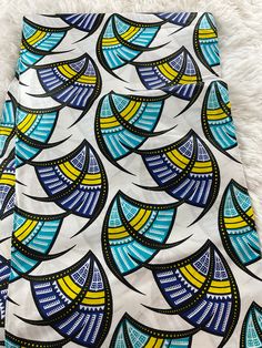 This African Fabric is high quality African print made from 100% cotton and it's 45 inches wide. It is used for making African Clothing, African quilts, & For Home decoration. FYI: Print is Double sided. The listing is for 1, 6 yards and Headwrap Each piece of fabric measures:  36in by 45in for 1 yard 216in by 45in for 6 yards 70in by 22in for Head wrap If you purchase more than one yard, you will receive one continuous piece. *If you require more than what I have listed, feel free to send me email. CARE INSTRUCTIONS: *DO NOT BLEACH *Hand wash with cold water and mild soap or Dry clean *Press with hot iron for a crispy look. Color may be different due to your monitor Traditional Printed Multicolor Fabric, Printed Multicolor Ankara Fabric, Cotton Fabric With Graphic Print, Multicolor Printed Ankara Fabric, Ankara Fabric With Unique Pattern Prints, Patterned Cotton Fabric With Graphic Print, Traditional Multicolor Printed Art, Multicolor Ankara Fabric With Abstract Pattern, Multicolor Print Fabric