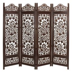 Add a hint of charm with this traditional 4 panel folding screen room divider in your home space. Providing function in a stylish way, these room dividers work double duty as privacy screens and standing against a wall as a large accent piece, or in the middle of a room to add some privacy and divided space, this room divider is too style to hide away. This item comes shipped in one carton. Suitable for indoor use only. Made in India. Features 4 carved screen panels. Traditional theme Color: One Wooden Room Divider, Temporary Room Dividers, Folding Screen Room Divider, Fabric Room Dividers, Portable Room Dividers, Bamboo Room Divider, Wood Room Divider, Sliding Room Dividers, Wooden Room Dividers