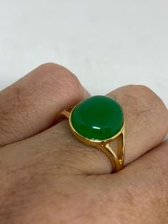 Vintage Lucky Green Nephrite Jade ring Fun jade is color enhanced Large green nephrite jade Ornate German Gold finished Vintage ring, does not tarnish, NOT sterling Size 5.75, 6, 7, 8, or 9 All rings are shipped free in the US in a nice gift box. Check out our over a THOUSAND great reviews Engraving is $4 per letter and is not always perfect depending on the piece. It can take a few days if the jeweler is busy. This is payable to Paypal Judithsltd@gmail.com Green Onyx Rings For Gift, Green Oval Rings With Natural Stones, May Birthstone Emerald Ring With Natural Stones, Green Onyx Round Jewelry, Green Onyx Emerald Ring, Green Jade Rings With Natural Stones, Green Cabochon Emerald Ring For May Birthstone, Green Chrysoprase Cabochon Rings, Green Rings With Natural Stones