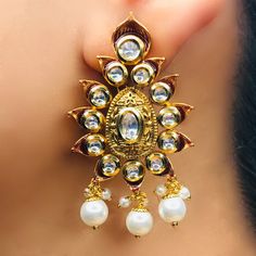 These are a beautiful pair of Earrings, made with beautifully Kundan beaded. These earrings work well with all types of clothing, whether it be formal attire or a casual party. Option 1: Red Color (E728) Option 2: White Color (E729) Eye-catching and unique jewellery that will set you apart. Gift this piece to a loved one, and see their face light up with joy. Best for gifting or for personal use, wear it to any occasion and be in the spotlight. Types Of Clothing, Saree Jewellery, Silver Pooja Items, Glass Bangles, Silver Toe Rings, Gold Chain With Pendant, Ruby Beads, Kundan Earrings, Face Light