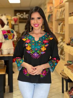 This Beautiful Floral Embroidered blouse is the perfect Top for every day use or a special event. It's made out of cotton and is full of vibrant embroidered florals. Machine Embroidered- hand manipulated. Embroidery will vary on each unique blouse. Available in sizes: S - 3X Belt NOT included Note: The belt can be purchase here: https://www.etsy.com/es/listing/690070823/fajo-artesanal-mexicano-accesorios-para?click_key=9d13602f75e61ce66cc3c925682af1a9c1a7f9d4%3A690070823&click_sum=ef5c49c9&ref=s Mexican Traditional Clothing, Mexican Style Dresses, Mexican Top, Full Sleeve Tshirt, Mexican Shirts, Mexican Blouse, Mexican Outfit, Diy Embroidery Designs, Western Outfits Women